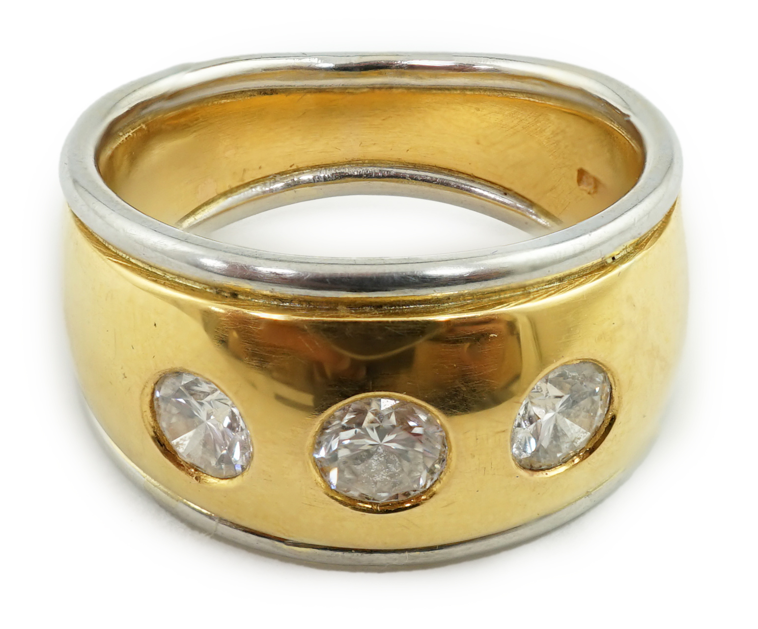 A 22ct gold and platinum gypsy set three stone diamond ring